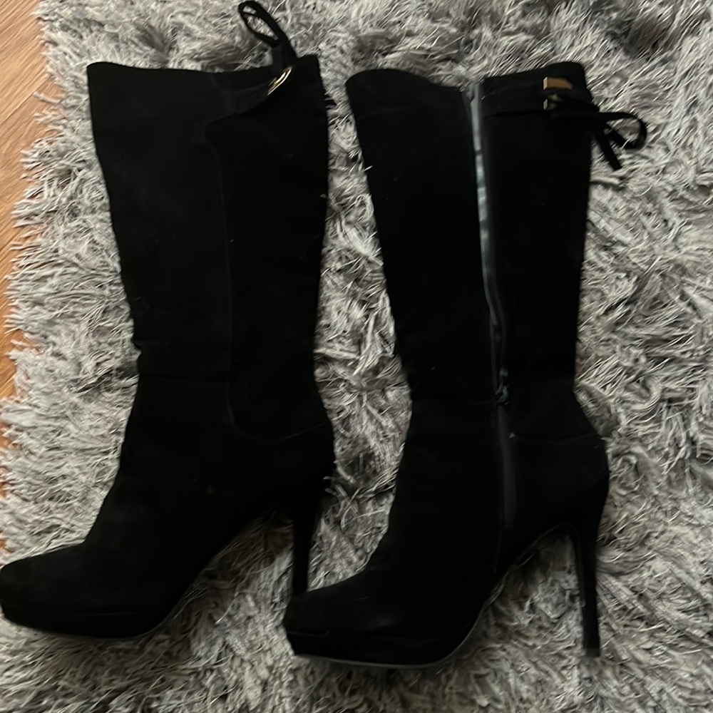 Suede heeled boots never worn. Have been stored away